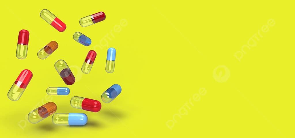 cluster of capsules and tablets on yellow background image